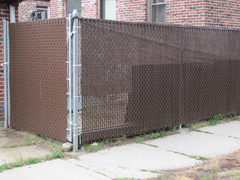 Brown Chain Link Fence with Wing Slats